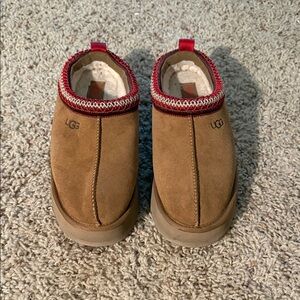 UGG women’s Brown Slip-On Loafers with Red Trim